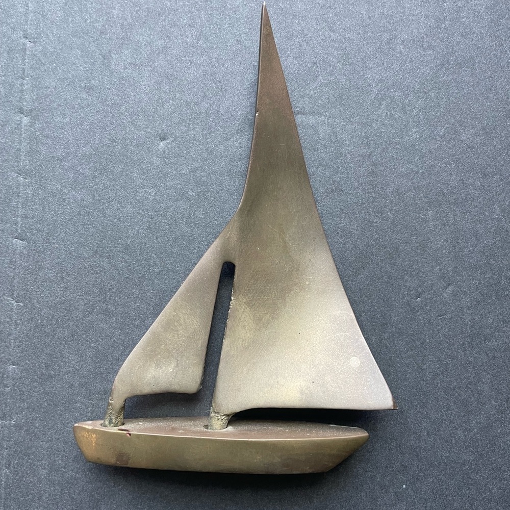 Vintage brass sailboat.